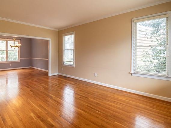 An empty room with a polished wooden floor